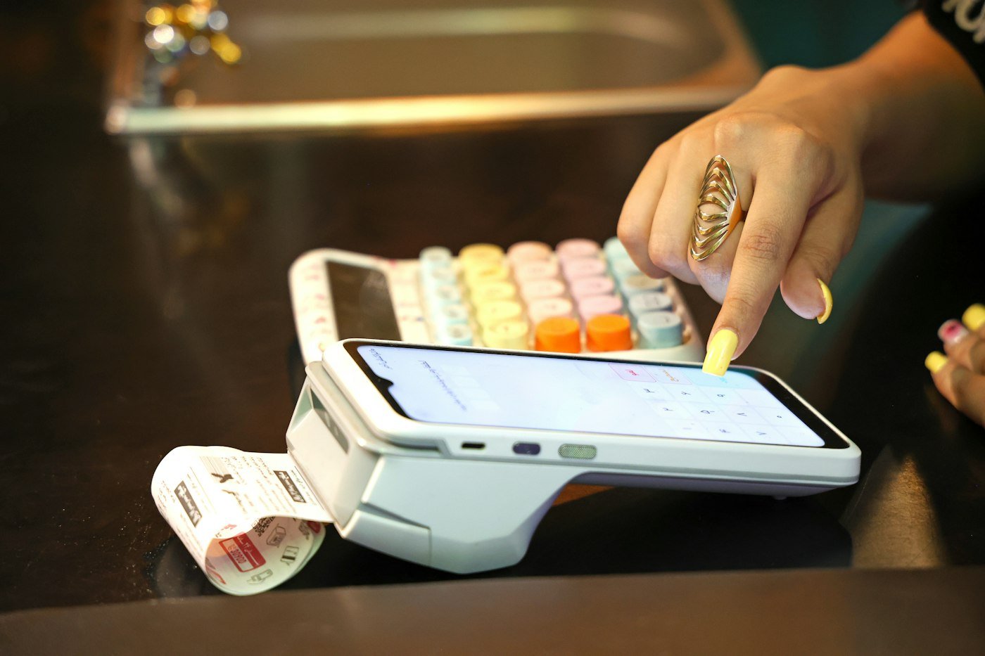 A card payment taken on a counter terminal, its receipt printing