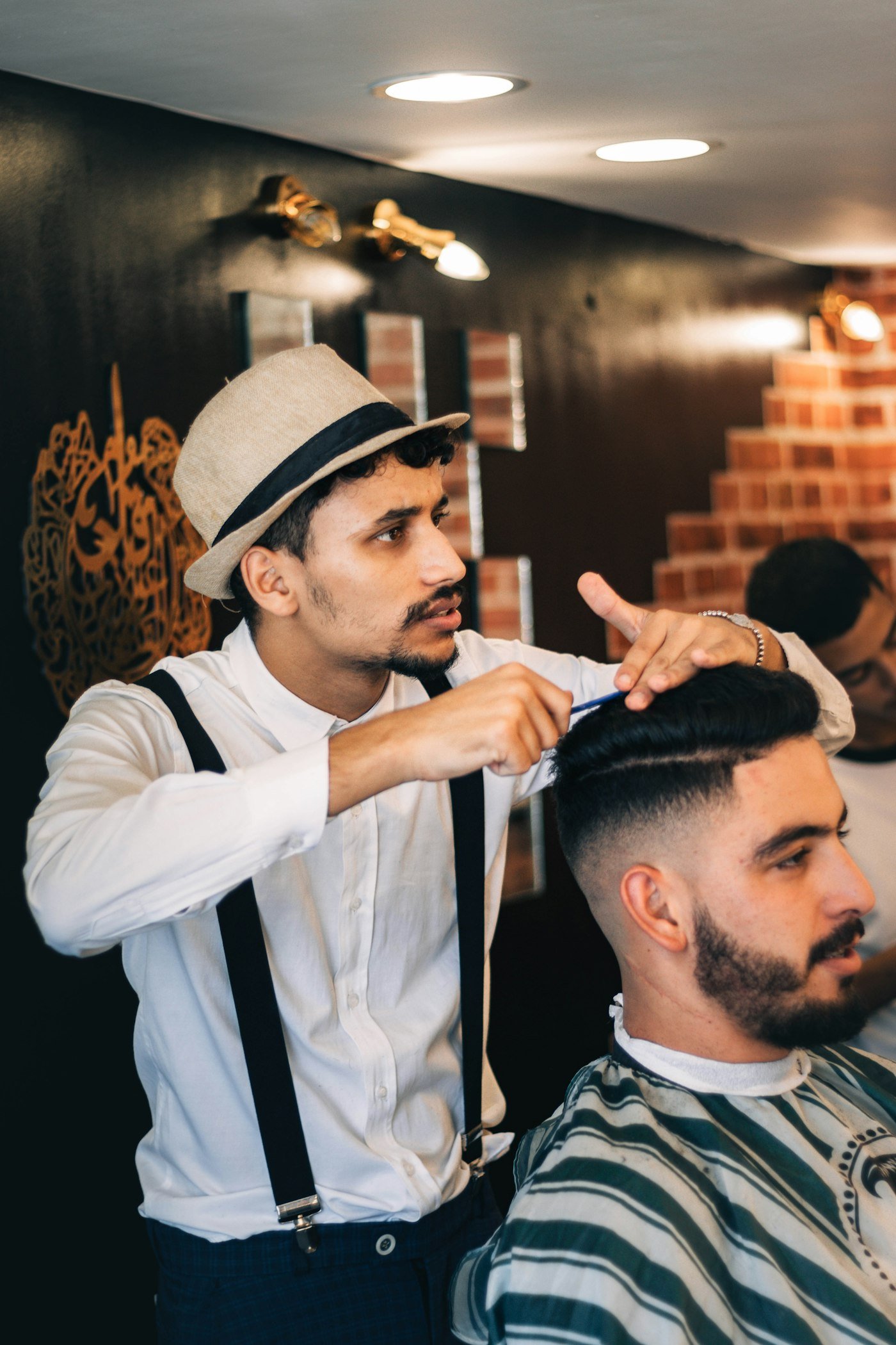 A barber at work in his own shop