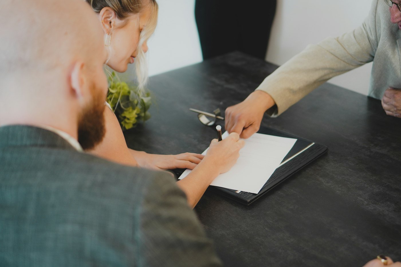 Two people going through a document together at a desk